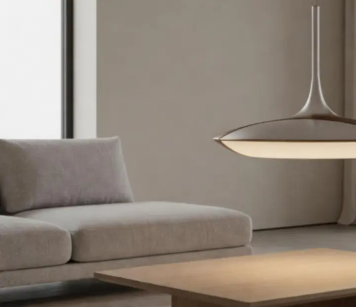 Minimalistyczna lampa wisząca Flos nad eleganckim stołem w nowoczesnym wnętrzu